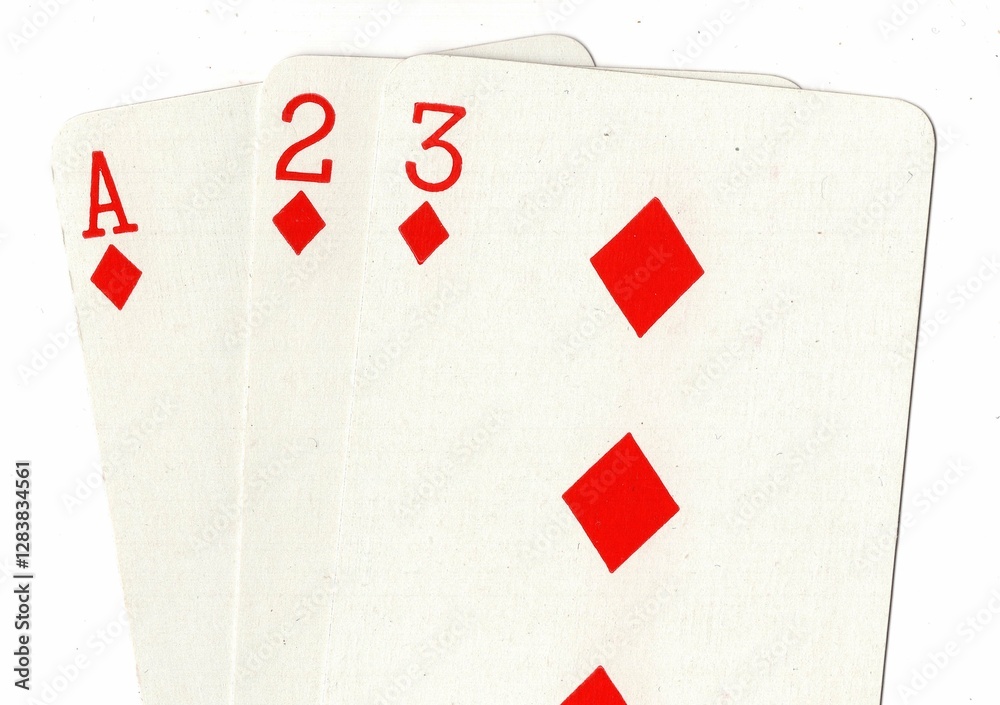 Obraz premium A hand of playing cards showing a run of ace, two and three in the same suit.