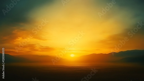 A magnificent sunset over a mountain range with colors of gold