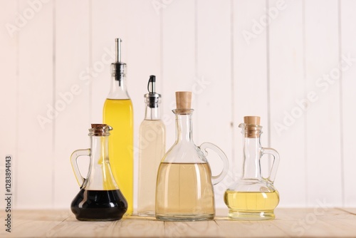 Wallpaper Mural Bottles of salad dressings on wooden table Torontodigital.ca