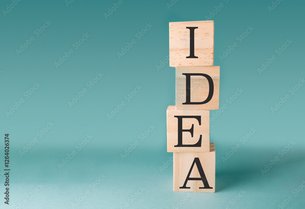 Stack of wooden blocks with the letters IDEA on top Stack of wooden blocks with the letters IDEA on top
