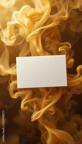 A blank white business card on a background of swirling golden smoke, creating an elegant and dynamic contrast, ideal for professional branding and contact information.