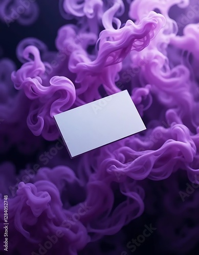 White business card centered on a swirling black smoke background, creating a striking, modern contrast, ideal for professional branding or contact information.