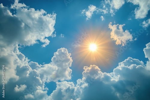 Bright Sun Illuminating Fluffy Clouds in a Vibrant Blue Sky During Midday