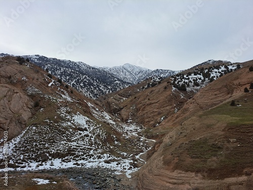 View of the Mountains covered with Snow in the Hissar National Nature Reserve in Qashqadaryo (Kashkadarya), Uzbekistan photo