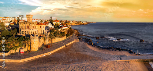 Portugal travel , scenic places. Estoril coastal town over sunset, Aerial drone view of sandy beach Tamariz and castle, popular tourist destination