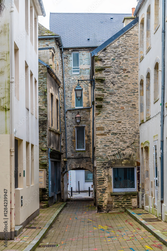 Fototapeta premium A view down a quaint narrow alleyway at Cherbourg, France in autumn
