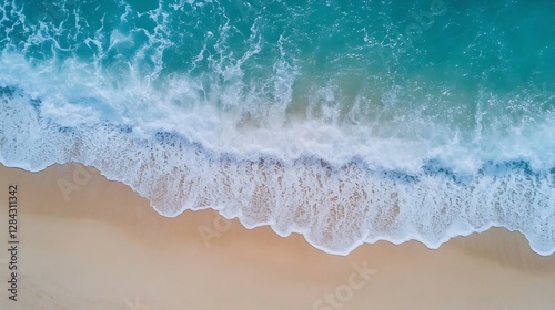 Stunning aerial view of ocean waves crashing onto the sandy beach creating a vibrant seaside landscape : Generative AI