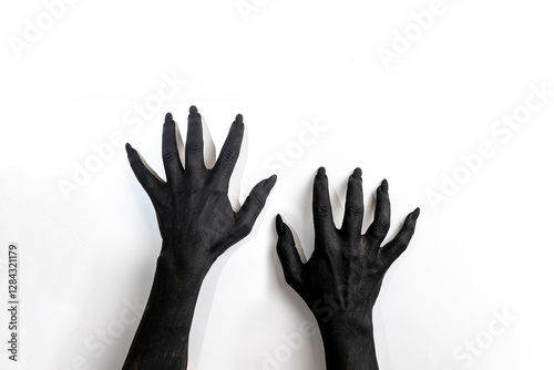 The woman hands with long nails painted in black color.