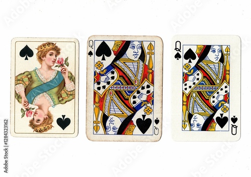 Vintage playing cards in three different designs showing the same value. photo