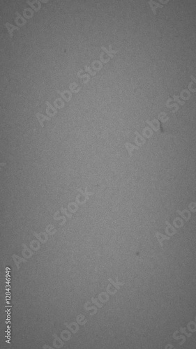 Grainy Grey Old-Fashioned 8mm Filmstrip Scroll Overlay with Scratched Texture and Old Vintage Look. Vertical Video. FL0055