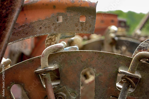 Mechanical device for planting potato tubers, close-up. Potato layer is a technical means used in mechanized planting of potatoes. Close-up of engineering thought. Potato-layer is a little rusty. photo