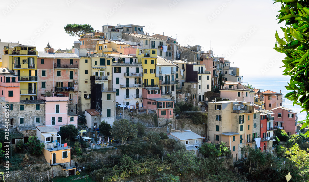 Obraz premium Panoramic view of the village of Corniglia, one of the five ancient villages of Cinque Terre, located on rugged northwest coast of Italian Riviera, Liguria. Well-known tourist location