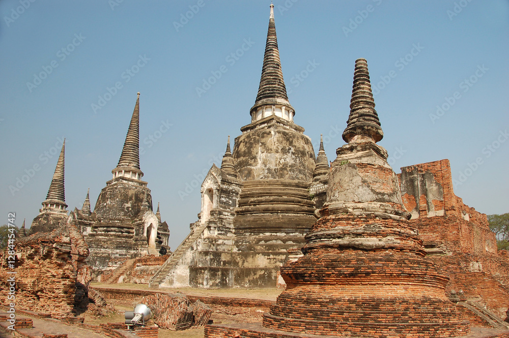Fototapeta premium Ancient temple ruins of Wat Phra Si Sampet in Ayutthaya, Thailand, showcasing Khmer-style architecture, historic stupas, and rich cultural heritage