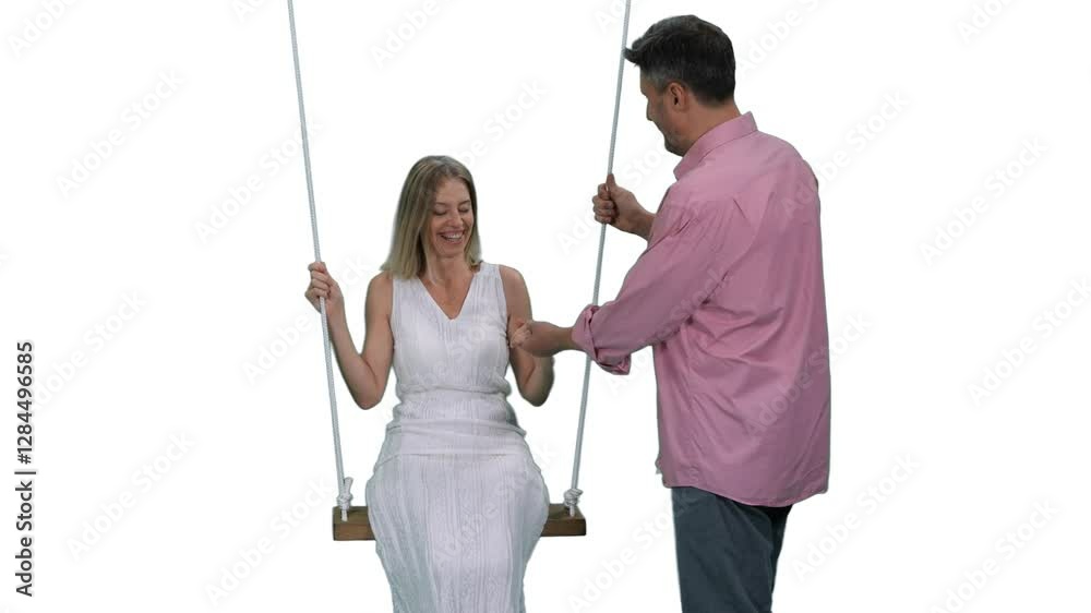 Close-up of adult man swinging beautiful woman in white dress on beach swing, Full HD footage with alpha transparency channel isolated on white background Close-up of adult man swinging beautiful woman in white dress on beach swing, Full HD footage with alpha transparency channel isolated on white background