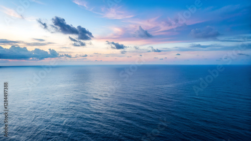 Wallpaper Mural Sunset Over the Open Ocean with Soft Sky Reflections on Calm Waters Torontodigital.ca