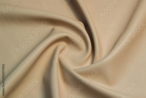 beige artificial leather with waves and folds on PVC base