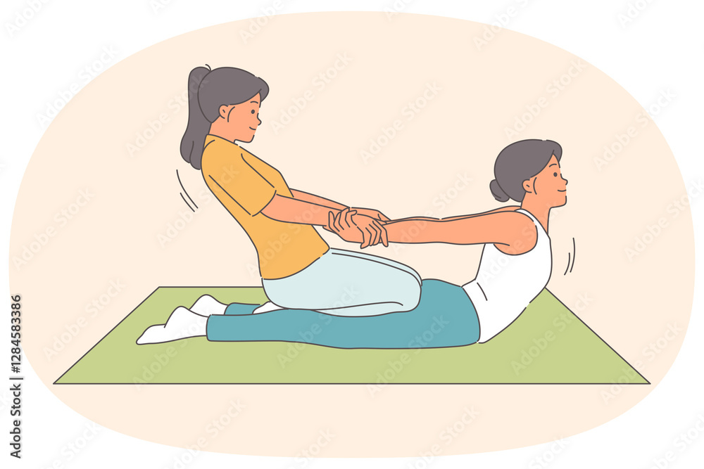 Obraz premium Thai massage for woman lying on floor, from girl masseur pulling patient hands to straighten spine