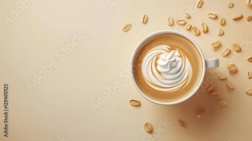 Cappuccino with cream swirl and coffee beans on beige background