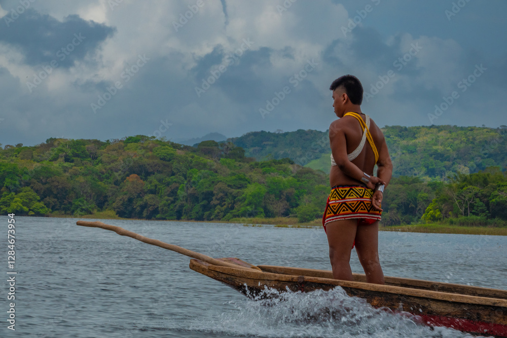 An Emberá man leading a conoe expenditions to the surveying Parará Puru village, Chagres National Park, Panama