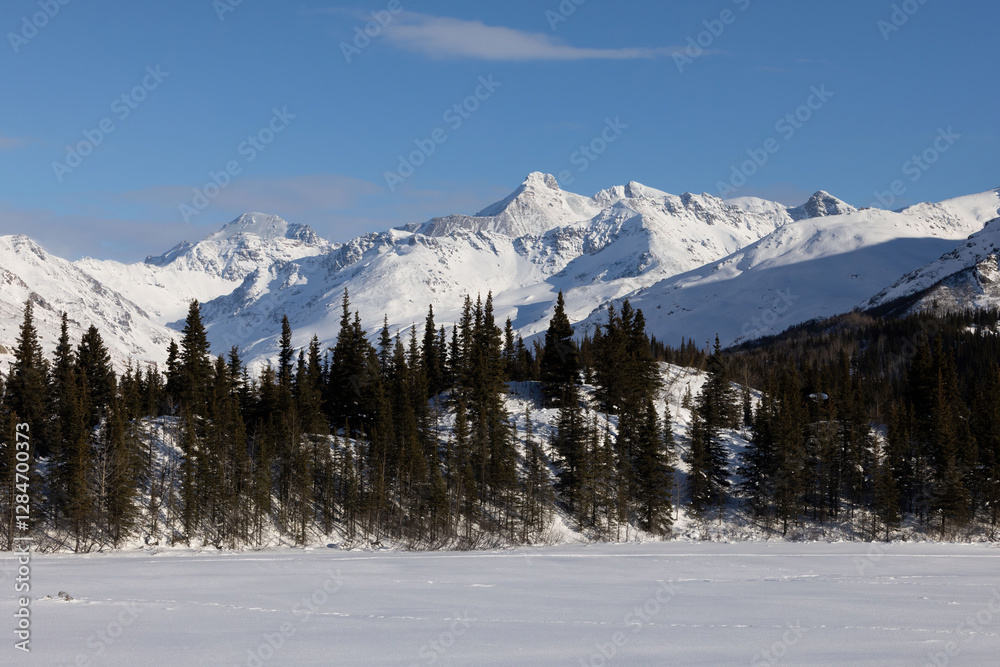 Sun shining on snowy mountains in Alaska. Sun shining on snowy mountains in Alaska.