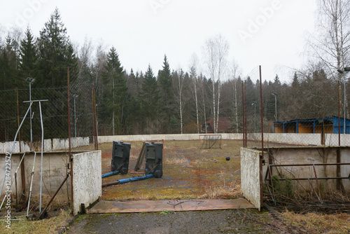 Wallpaper Mural An abandoned multi-purpose sports field for basketball, hockey, and football. Hockey boards, small goals, and a ball Torontodigital.ca