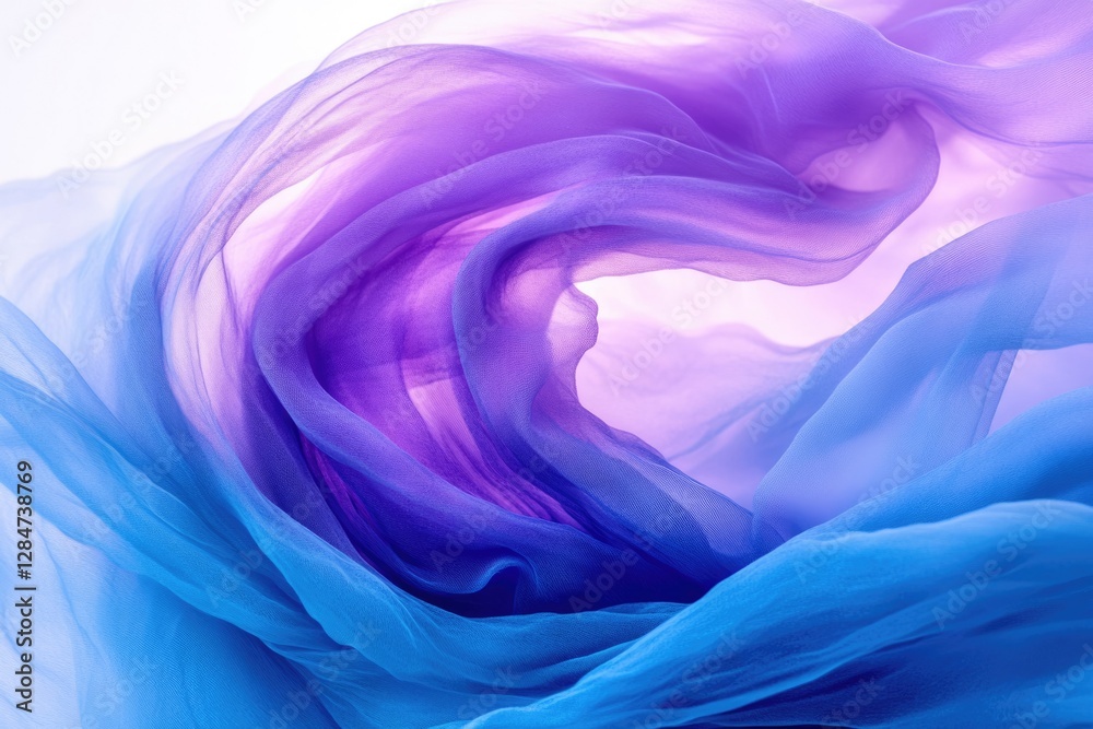 Obraz premium Swirling ombre chiffon fabric in shades of blue and purple, creating a dreamy, abstract texture.