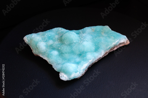 Blue hemimorphite isolated on black background photo