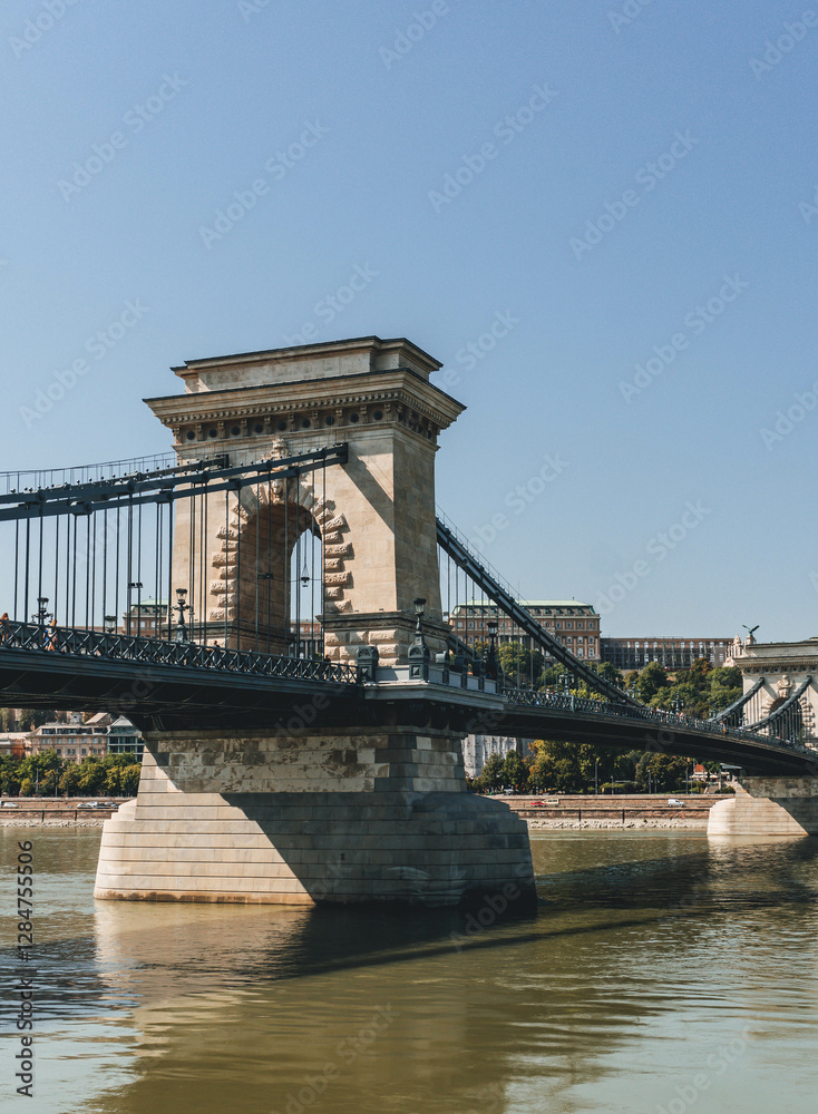 Obraz premium chain bridge over river with beautiful stone made design over danube hungary