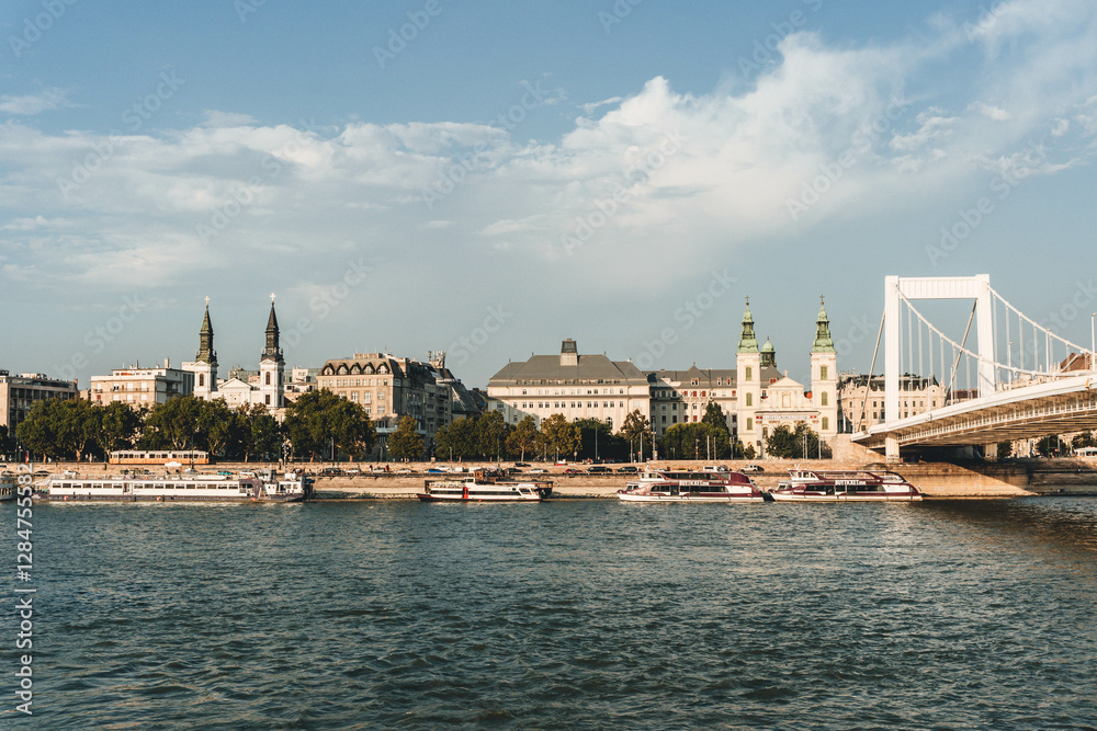 Fototapeta premium modern river bank side with bridge and churches in front 
