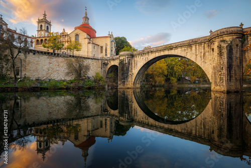 Sao Goncalo bridge over Tamega river and Sao Goncalo church at sunset in Amarante, north of Portugal 