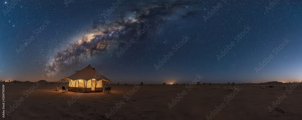 Obraz premium Starry night over desert camp with glowing tent under milky way galaxy