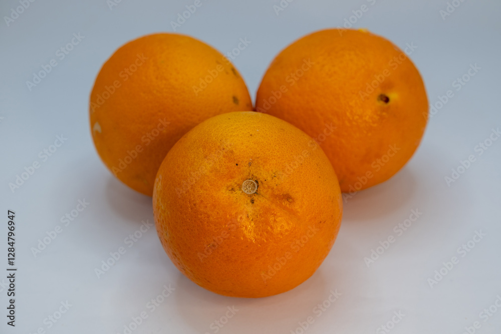 Orange with natural and slightly rough peel texture Orange with natural and slightly rough peel texture