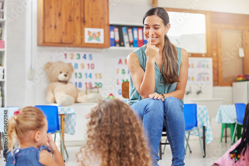Class, woman teacher and teaching children at school, kindergarten education and point to nose. Playful, educator and communication with kids at learning academy, lesson and knowledge development