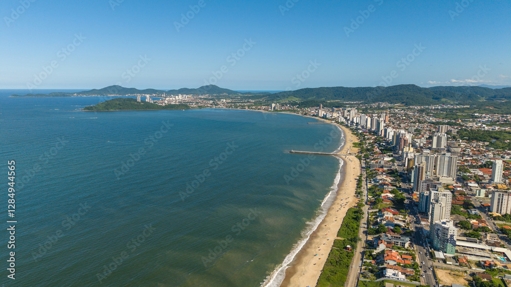 Fototapeta premium Aerial view of the coastal city of Balneário Piçarras, with Penha and the Atlantic Ocean in the background