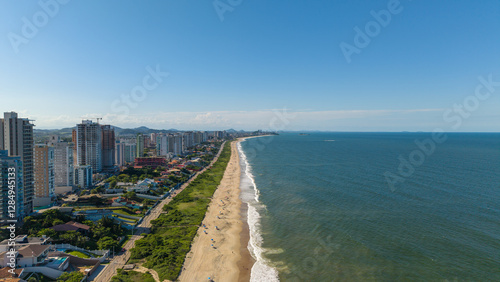 Wide coastline of the coastal city of Balneário Piçarras, in the state of Santa Catarina, Brazil, on a beautiful sunny day.