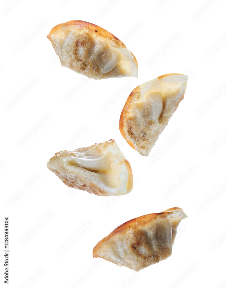 Tasty roasted gyoza (dumplings) in air on white background Tasty roasted gyoza (dumplings) in air on white background