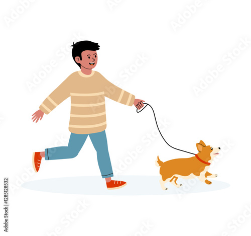 Young boy happily walks his corgi on a sunny day in a park setting