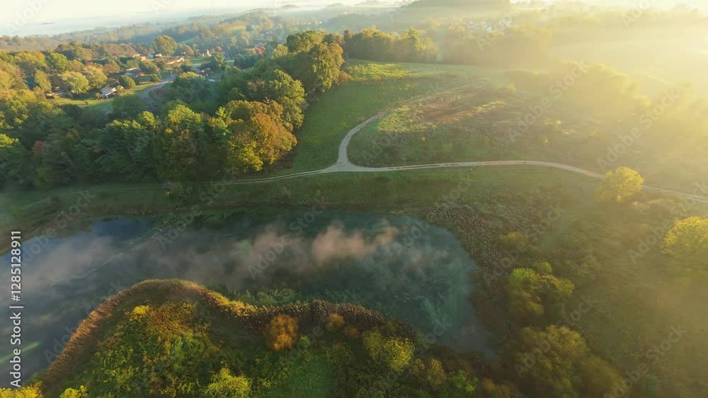 Aerial Drone View of Misty Pond and Trails Johnson City, TN scenic drone view of misty pond, winding trails lush greenery at sunrise Johnson City, Tennessee golden sunlight peaceful serene atmosphere Aerial Drone View of Misty Pond and Trails Johnson City, TN scenic drone view of misty pond, winding trails lush greenery at sunrise Johnson City, Tennessee golden sunlight peaceful serene atmosphere