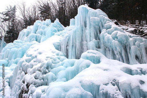 Ice formations on frozen mountain waterfall