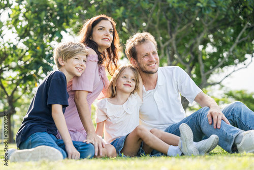 Wallpaper Mural Happy family parent children having picnic outdoor activity. Enjoy happiness moment summer playing together including father mother son and daughter relaxing in the morning sunrise. Torontodigital.ca