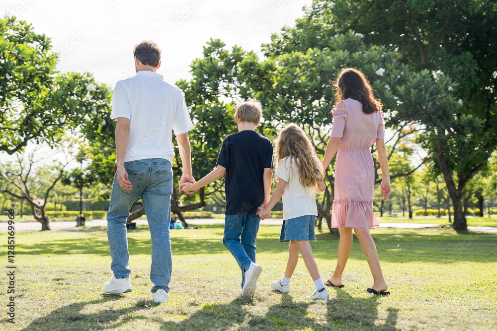 Obraz premium Happy family parent children having picnic outdoor activity. Enjoy happiness moment summer playing together including father mother son and daughter relaxing in the morning sunrise.