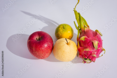 Dragon fruit, placed on the table, helps with weight loss by being low in calories, stimulates milk production in women, and may aid in preventing prostate cancer with its nutrient-rich composition. photo