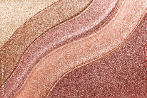 Makeup texture background. Bronze shimmer metallic lipstick or liquid eye shadow palette smeared