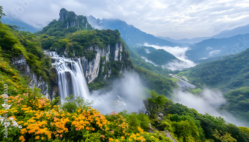 Majestic waterfall cascades down mountain, misty valley, vibrant flowers. Use Travel brochure