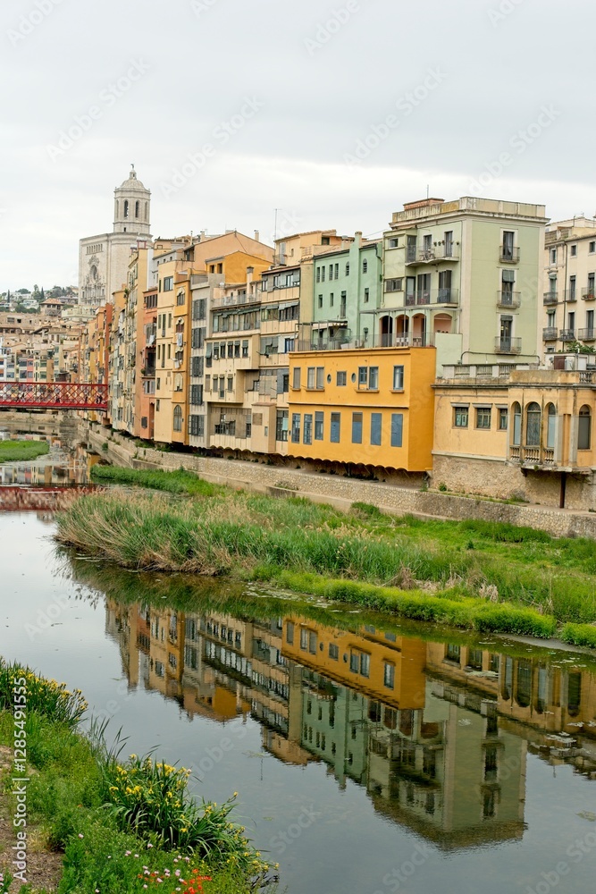 Girona Spain - 25 April 2024 - Colourful houses along the Onyar River in Girona Girona Spain - 25 April 2024 - Colourful houses along the Onyar River in Girona