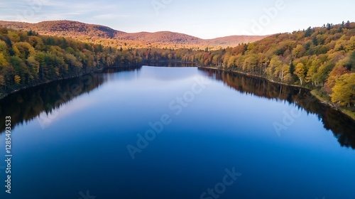 Serene Lake Surrounded by Vibrant Autumn Foliage and Blue Sky : Generative AI