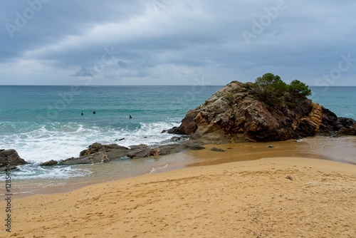 Palamos Spain - 29 April 2024 - The beach at Platja de La Fosca near Palamos at the Costa Brava in Spain photo