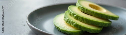 Plate with a cut avocado on it