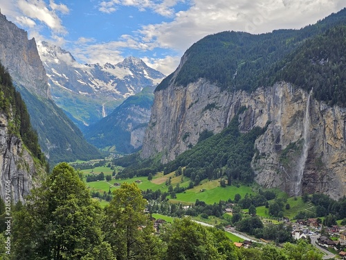 A stunning summer photo of Brienzer Rothorn, one of Switzerland’s most beautiful peaks, showcasing its majestic view over the surrounding Swiss Alps. The image captures the lush green landscapes and v