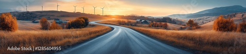 Winding road through a golden countryside with wind turbines and distant mountains. Generative AI